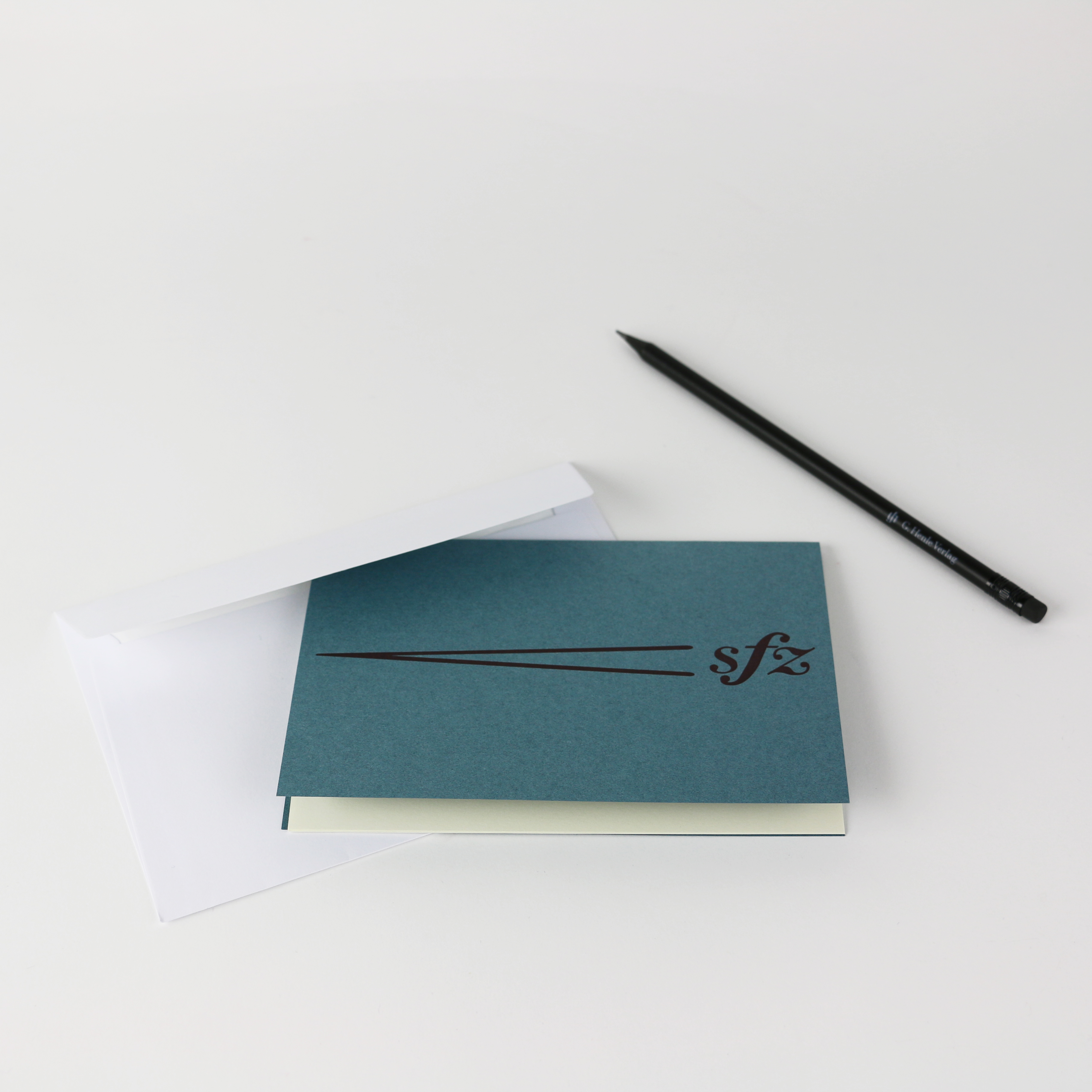 Card with debossed motif, paper insert and envelope

